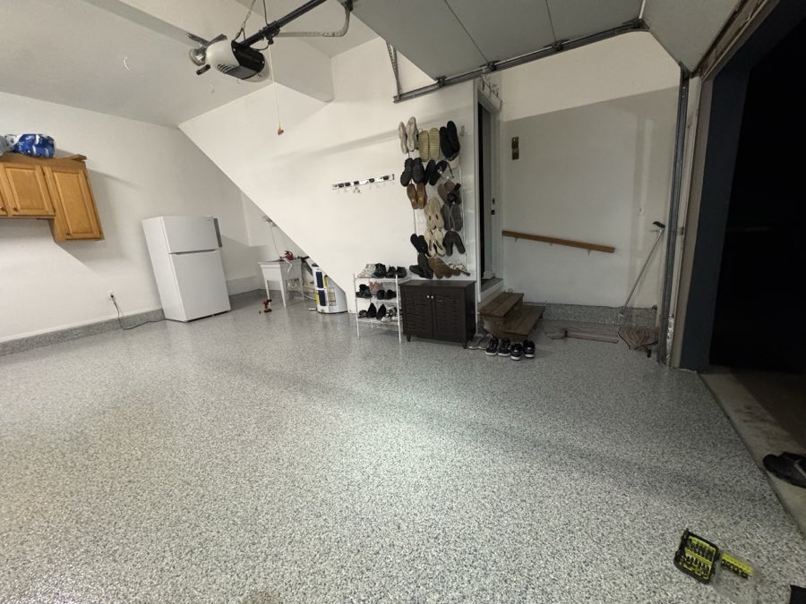 Garage floor coated around installed storage and cabinets